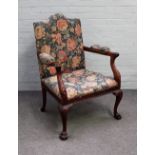 A mid-18th century style mahogany open arm/ Gainsborough style chair with carved frieze on ball and