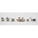 A group of mostly silver miniatures, comprising, an oval twin handled gallery tray,
