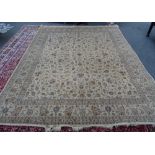 A Hereke silk carpet, Turkish, the ivory field with a delicate allover floral vine design,