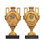 A pair of North European simulated marble and parcel gilt two handled vases,