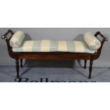 A Regency style stained beech window seat with scroll ends and turned supports,