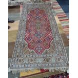 An Indian rug of Joshaghan design, 222cm x 119cm.