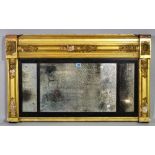 A Regency style gilt framed overmantel wall mirror, 97cm wide x 57cm high.