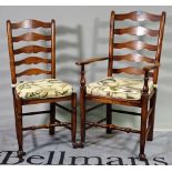 A set of eight 18th century style ash ladderback dining chairs to include two carvers,