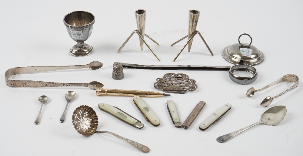 Silver and silver mounted wares, comprising; two pairs of sugar tongs, a sugar sifting spoon,