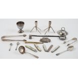 Silver and silver mounted wares, comprising; two pairs of sugar tongs, a sugar sifting spoon,