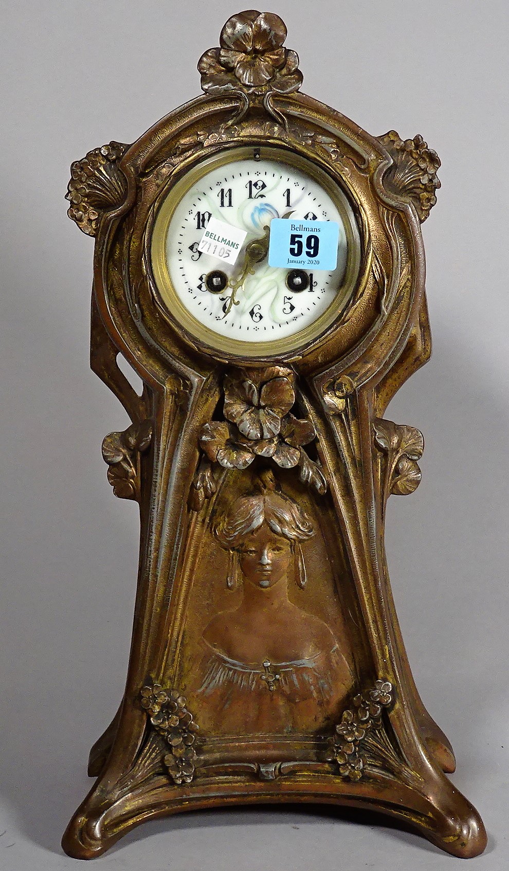 An Art Nouveau spelter mantel clock, 36cm.