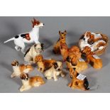 Royal Doulton; a group of twelve various dog finials, the largest 9cm high.