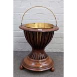 A 19th century Dutch inlaid walnut jardinaire with open slatted body on four spherical supports,
