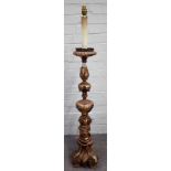 An 18th century Italian polychrome painted altar candlestick, 95cm high, excluding fittings.