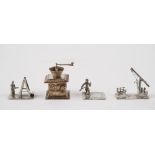 A silver model of a miniature coffee grinder,