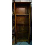 A 20th century stained beech floor standing open bookcase on cabriole supports,