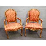 A pair of Louis XV gilt framed open armchairs with serpentine seat and cabriole supports,