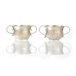 A Britannia Standard silver twin handled miniature porringer, with partly fluted decoration,