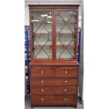 An early 19th century inlaid mahogany secretaire cabinet with pair of astragal glazed doors over