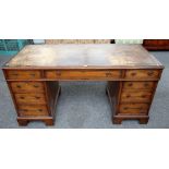 A 19th century mahogany pedestal desk with nine drawers about the knee, on bracket feet,