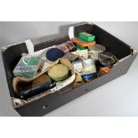 A large fruit box with a tackle box and lures, fly boxes, fly lines and further fishing items,