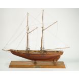 A scratch built wooden model ship 'Bluenose 1921' on an oak plinth,