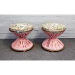 A pair of 19th century walnut framed footstools, of hour glass form, 46cm diameter x 46cm high, (2).