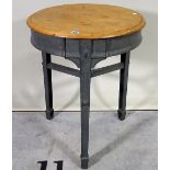 A circular occasional table, with stripped mahogany top on a grey painted cast iron base,