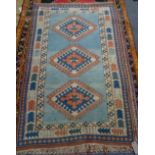 A Turkish rug, blue field, 203cm x 124cm.