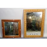 A 20th century pine framed rectangular wall mirror with carved decoration,
