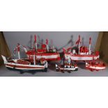 A group of eight 20th century scratch built and painted boats of various sizes,