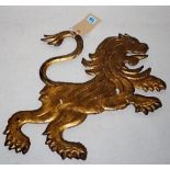 An early 20th century gold painted cast iron flatback figure of a lion, 54cm wide.