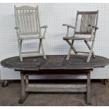 A 20th century teak oval garden table,