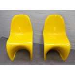 Probably Verner Panton; a pair of yellow resin moulded chairs, 47cm wide x 87cm high, (2).