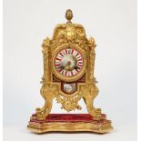 A French Louis XVI style gilt metal and porcelain mounted mantel clock, early 20th century,