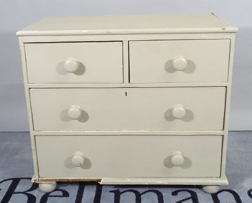 A late Victorian grey painted pine chest of three long drawers on bun feet, 87cm wide x 77cm high.