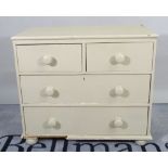 A late Victorian grey painted pine chest of three long drawers on bun feet, 87cm wide x 77cm high.