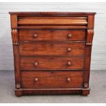 An early Victorian mahogany chest, with cushion frieze drawer over dummy drop drawer,