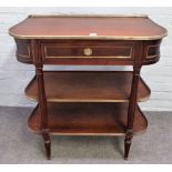 An early 20th century French brass mounted mahogany three tier side table,