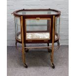 An unusual early 20th century French stained beech and brass freestanding display cabinet of