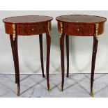 A pair of late 19th century French walnut with oval single drawer and gilt metal mounted side