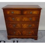 A George III style mahogany chest of two short and three long graduated drawers on bracket feet,