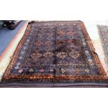 An Afghan Baluche sleeping rug, the field made up of diamonds, an indigo flower border, long pile,