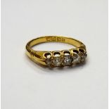 An 18ct gold and diamond set five stone ring,