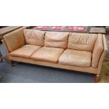 Stowey Dansk Design; a tanned leather square back three seater sofa, on block supports,