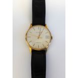 A Garrard Quartz 9ct gold circular cased gentleman's wristwatch,