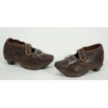 A pair of Georgian child's leather shoes, with metal buckles and wooden soles, 13cm, (2).