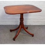 A George III mahogany centre table, the rectangular snap top on four downswept supports,