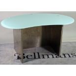 A modern polished steel and blue glass kidney shaped desk, 140cm wide.