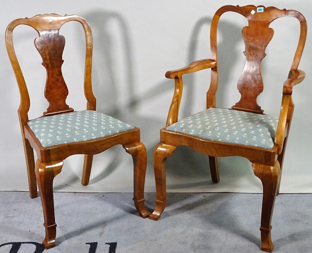 A set of eight 18th century style walnut vase back dining chairs, to include two carvers,