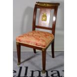 A 19th century Empire style mahogany and ormolu mounted hall chair, 45cm wide x 85cm high.