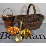 A large 20th century wicker log basket and a quantity of copper and brassware, (qty).