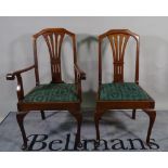 A set of eight Edwardian mahogany dining chairs with splatbacks on cabriole supports to include two