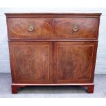 A George III inlaid mahogany rectangular cabinet, the fitted drawer over a pair of cupboards,
